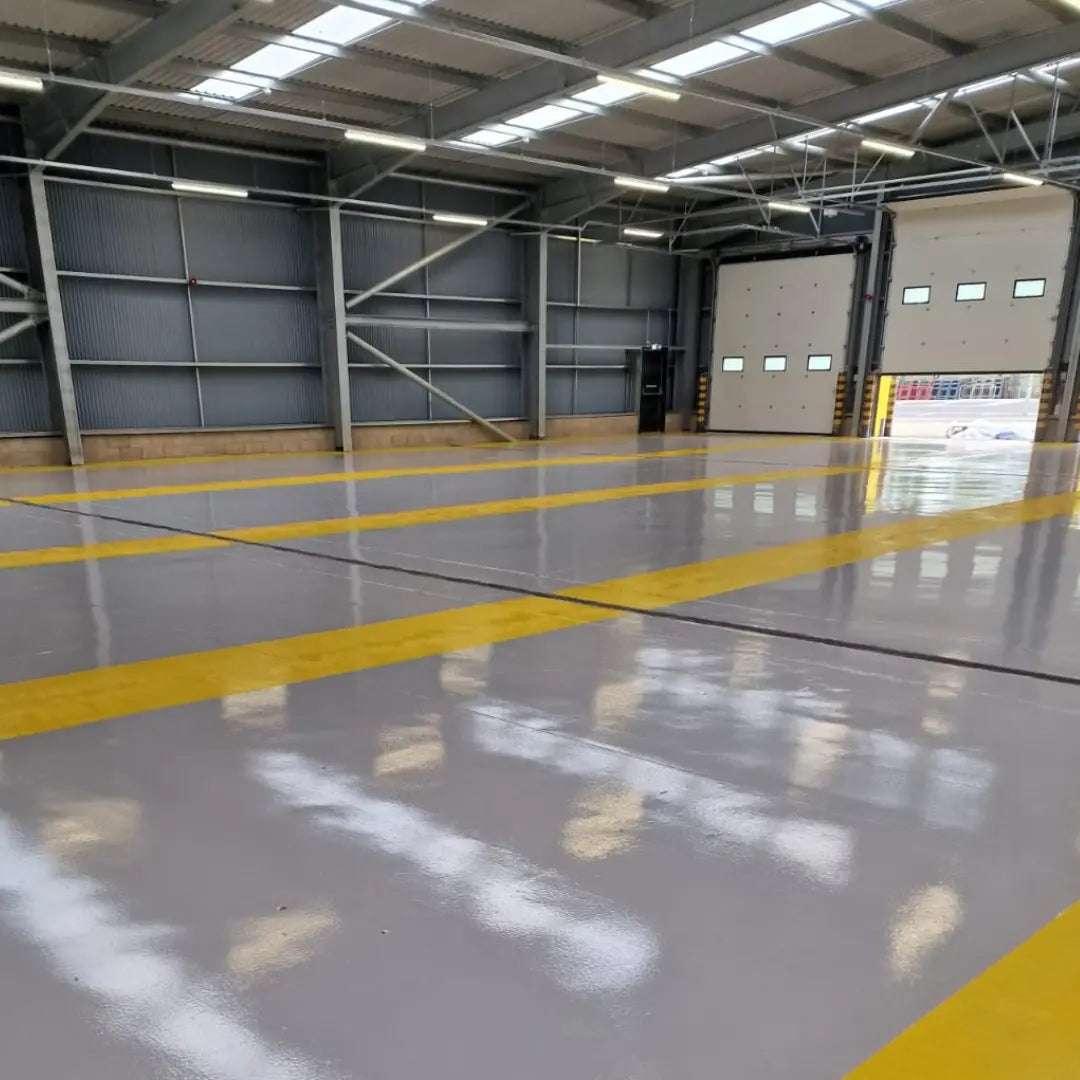 Large industrial warehouse with concrete floor and high ceiling