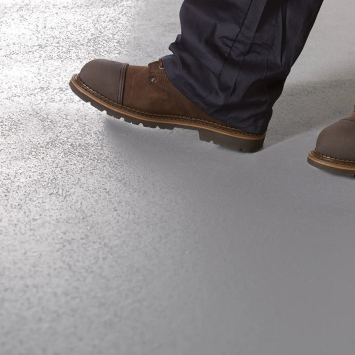 Brown shoes on a grey floor painted with Blackfriar Anti-Slip Floor Paint