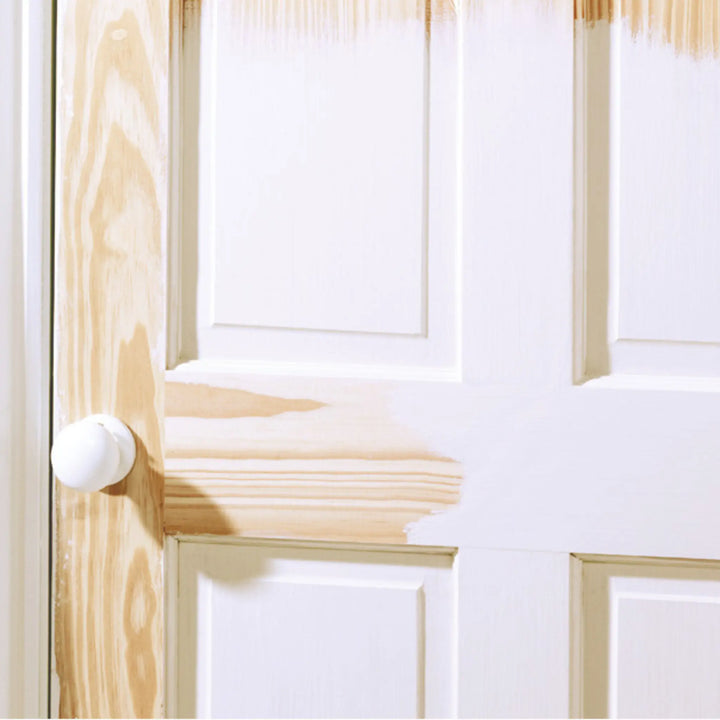 Close-up of a wooden door with a white handle
