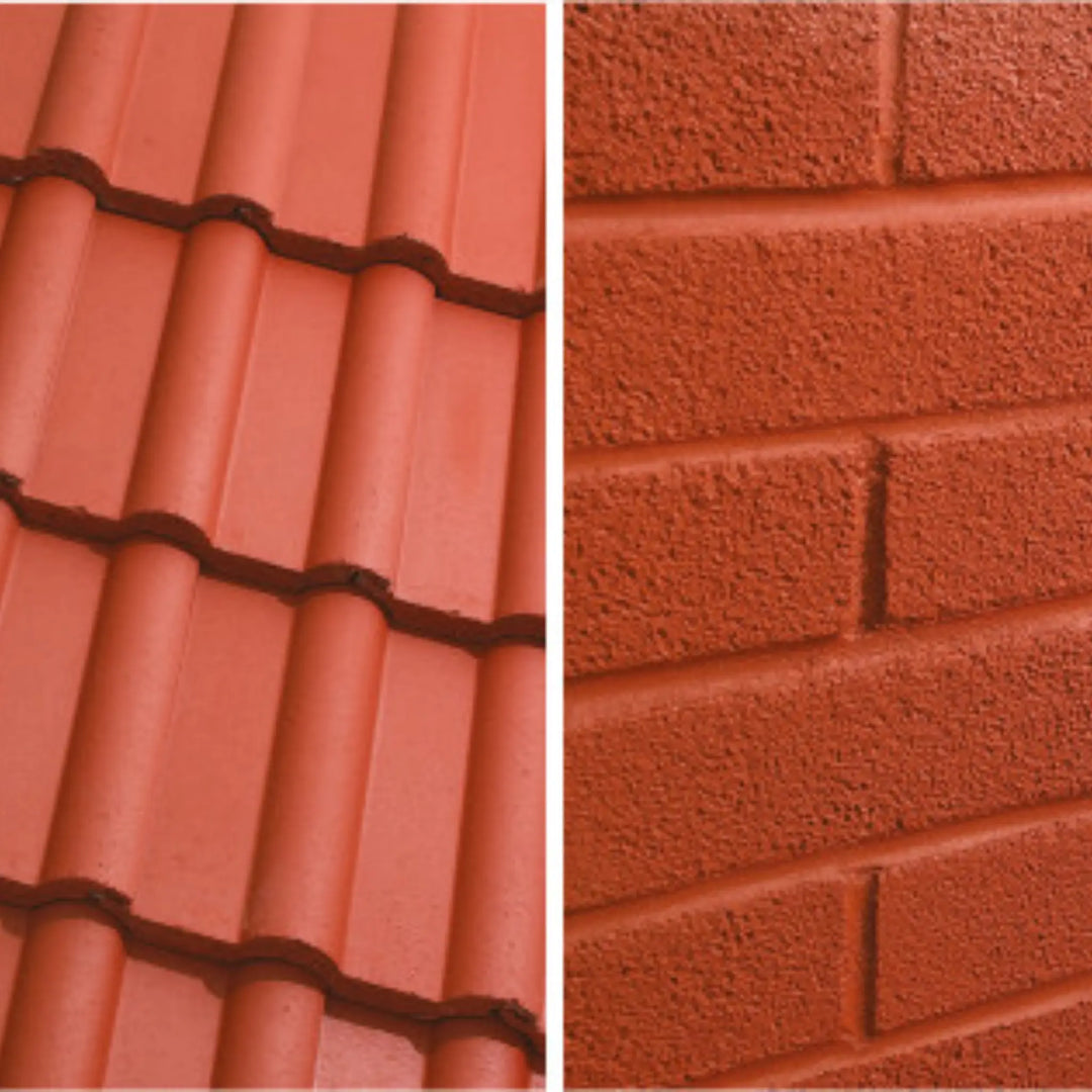 Close-up of red roof tiles and textured red brick wall.