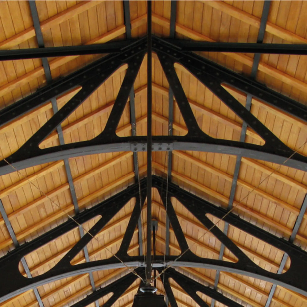 Wooden ceiling with black metal beams