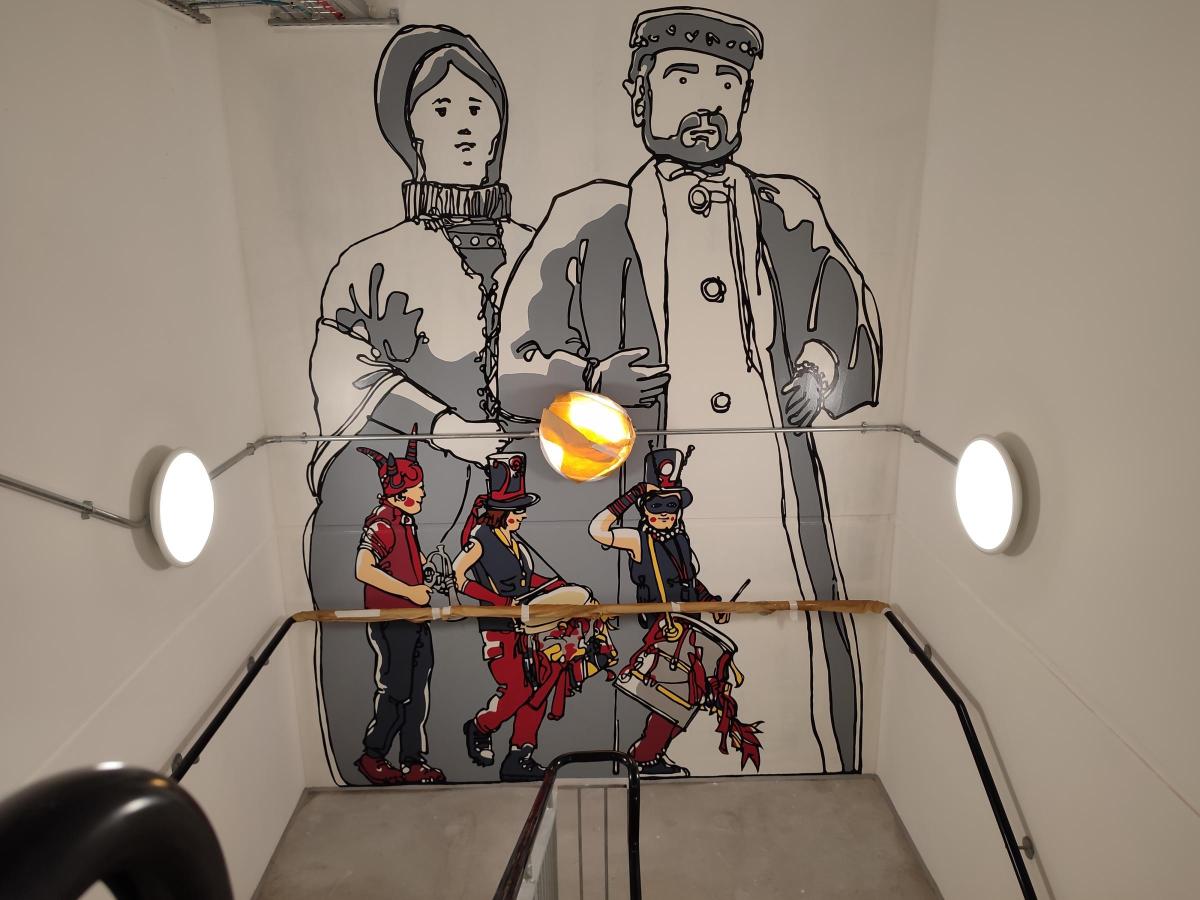 Illustration of a couple with children on a wall 