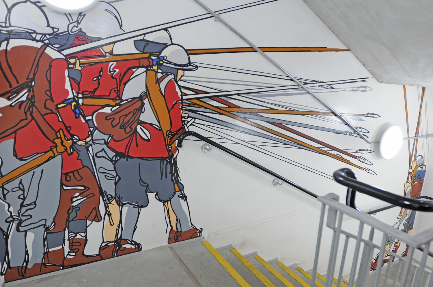 Stylized mural of soldiers with spears on a staircase wall.