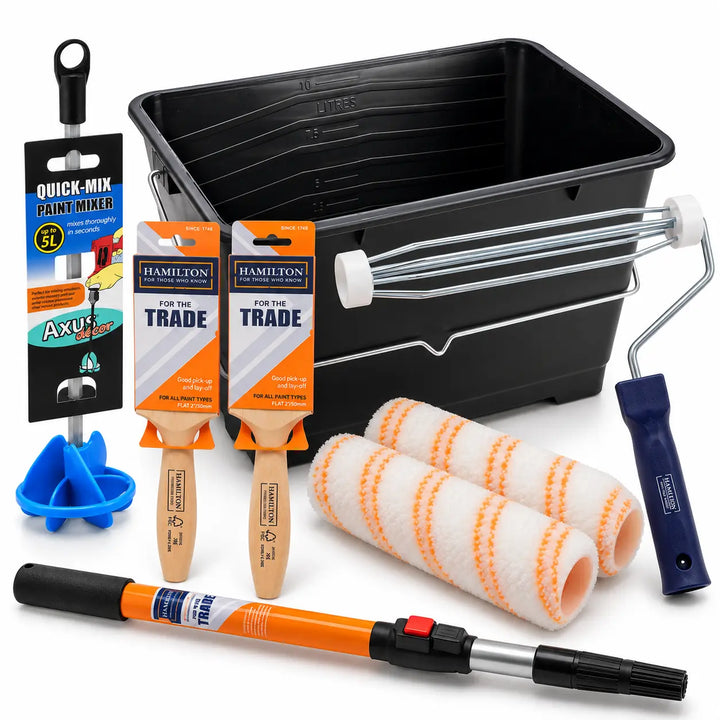 A paint roller kit arranged on a white background, including a black paint bucket with a metal handle, two orange-and-white paint rollers, an orange telescoping paint extension pole, a packaged paint mixer stick, two paint brushes, a blue plastic tray, and a paint roller cover.