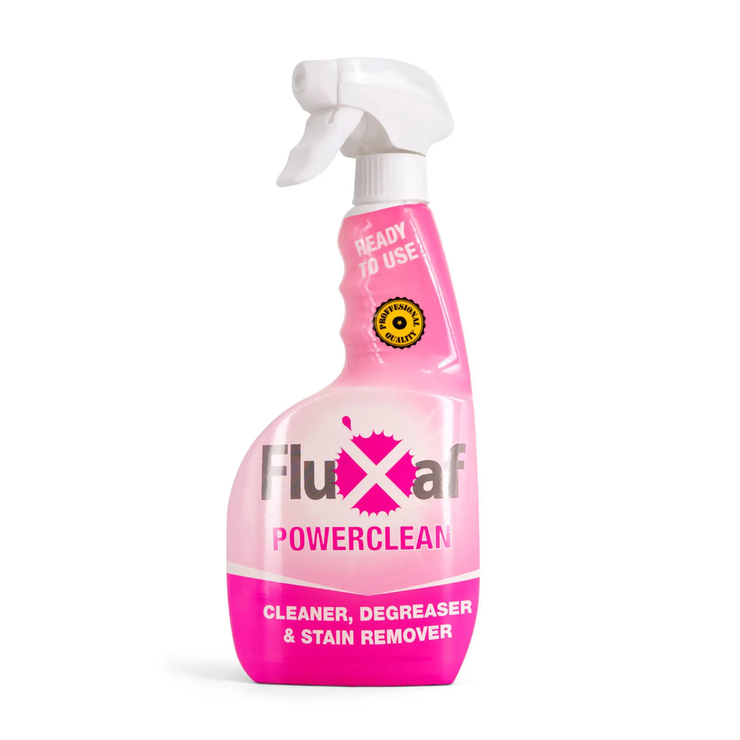 Pink spray bottle labeled 'Fluxaf Powerclean' on a white background