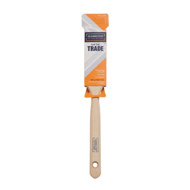 Paint brush with packaging labeled 'For the Trade' on a white background