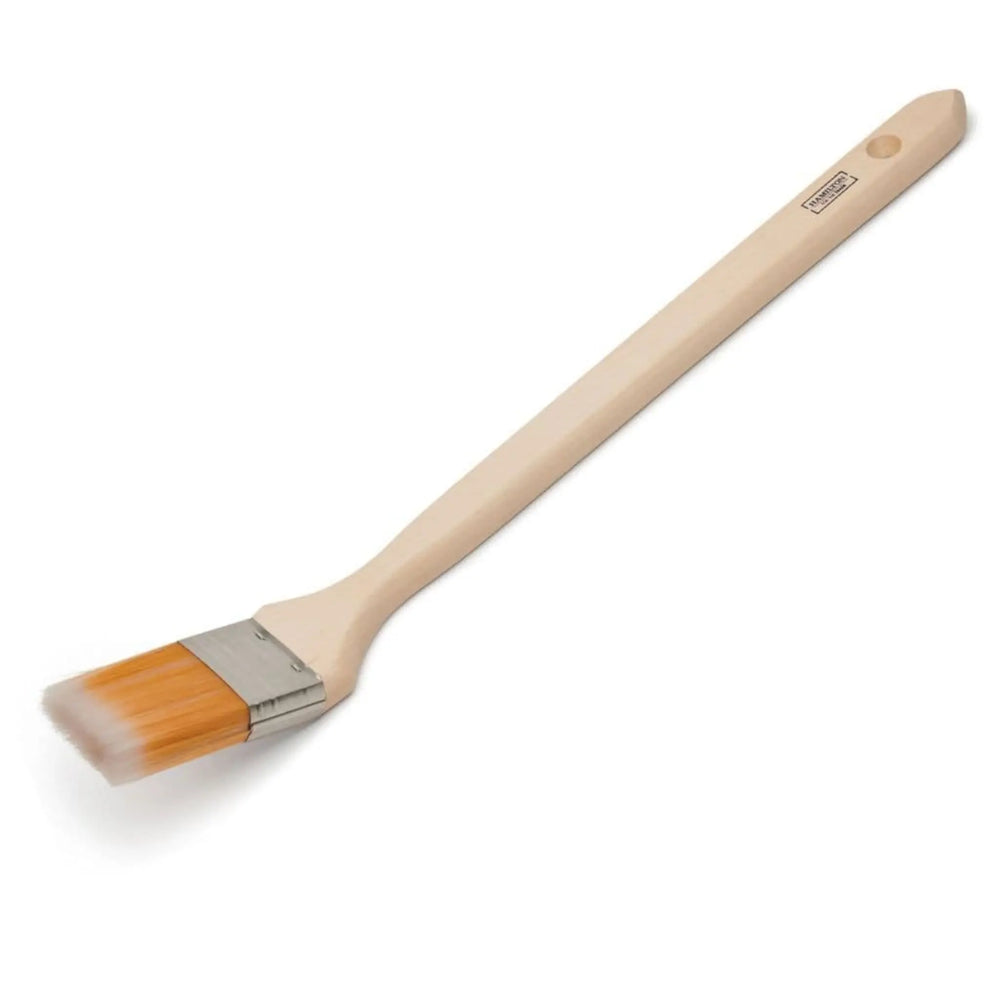 Paint brush with wooden handle and bristles on a white background