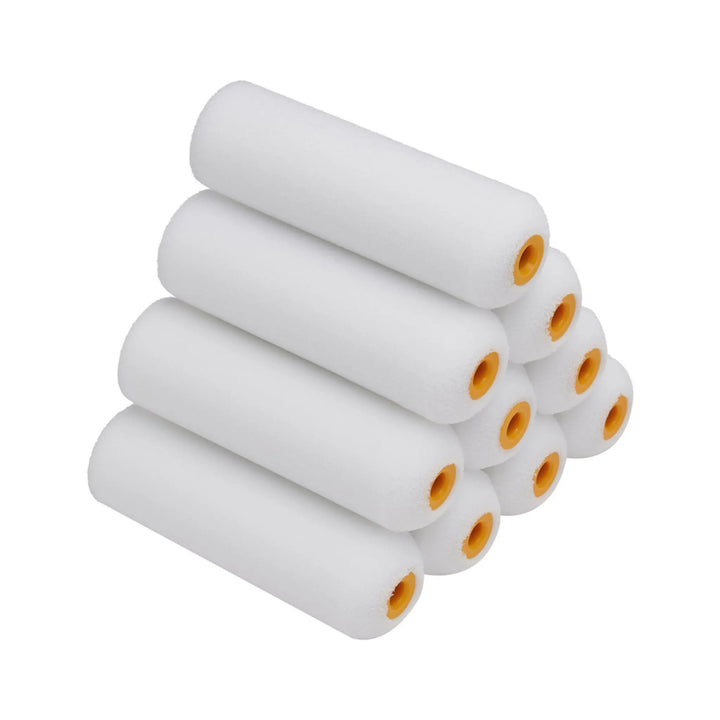 Set of white paint rollers with yellow centers on a white background