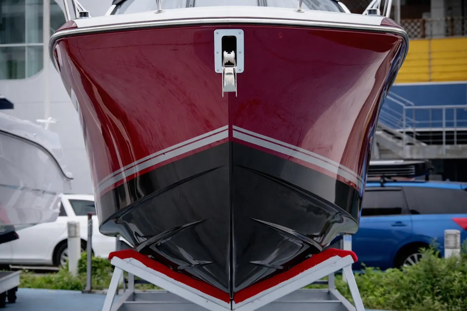 Hull of a boat freshly painted black & red 
