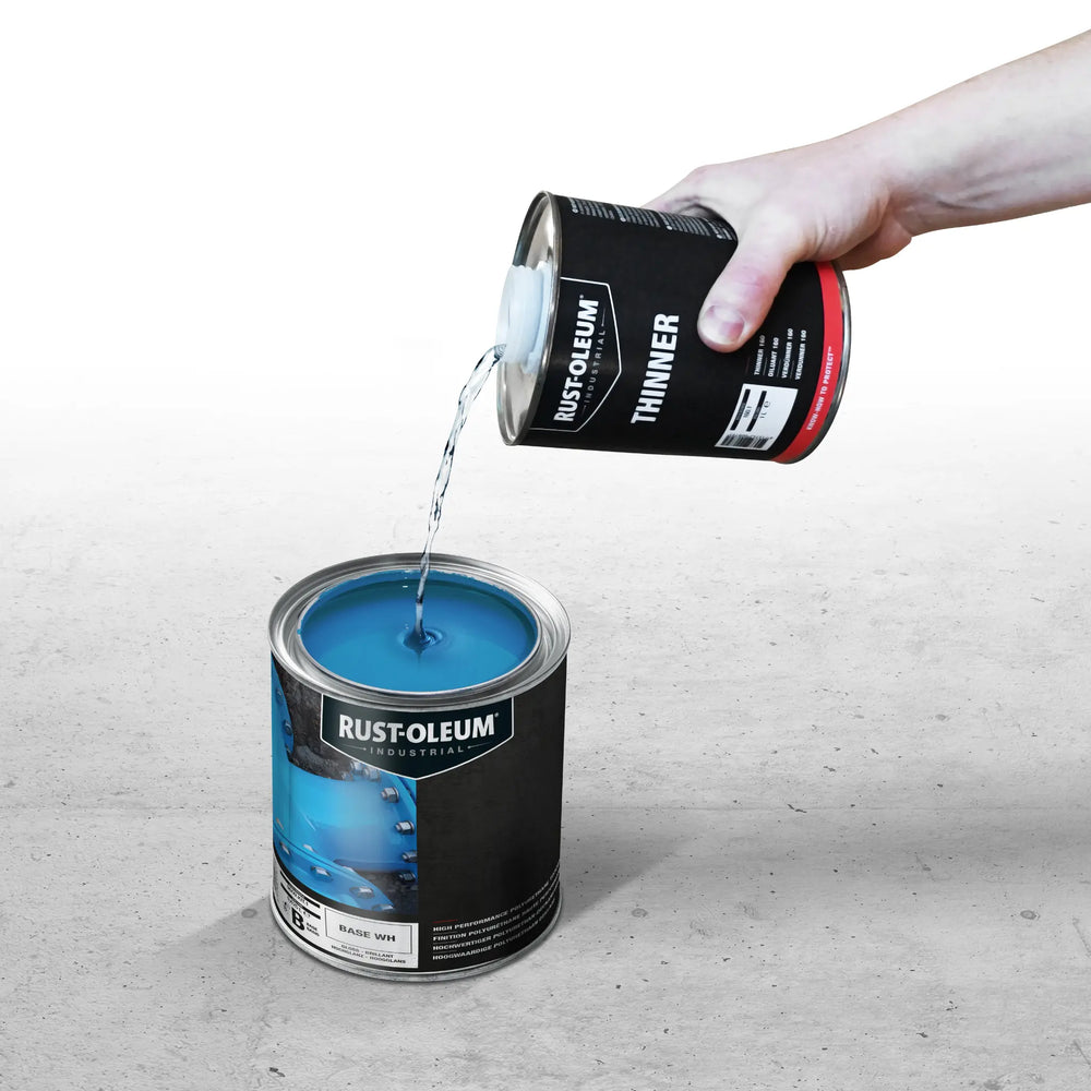 Rust-Oleum Thinner being poured into Rust-Oleum paint tin