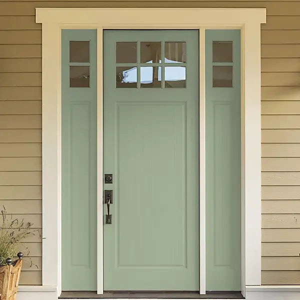 Green front door with glass panels on a beige house painted with upvc bramwell